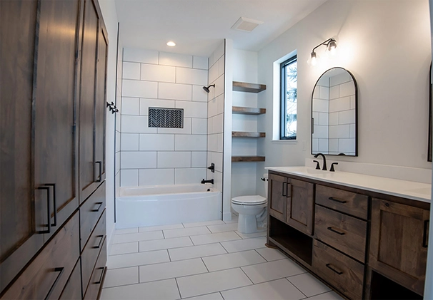 Modern walk-in tile shower with custom vanities in Zimmerman MN