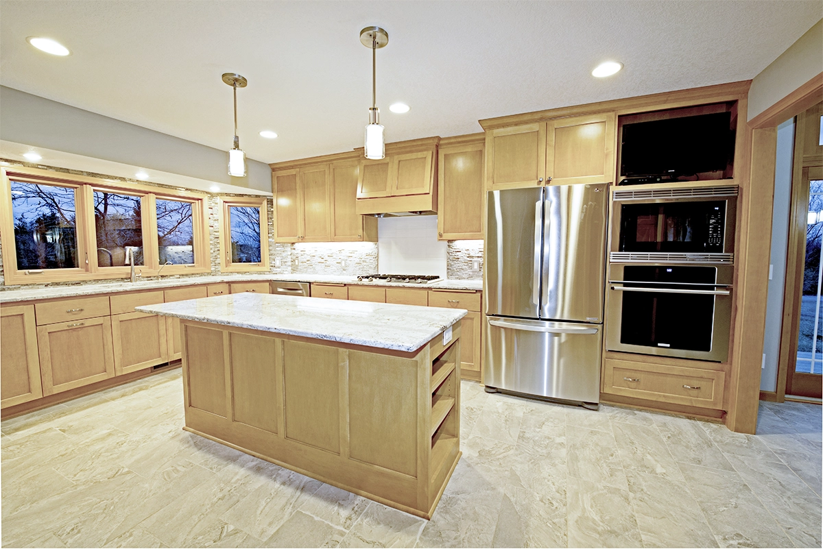 Expanded kitchen remodel in Ramsey MN featuring custom maple cabinets and Cambria quartz countertops