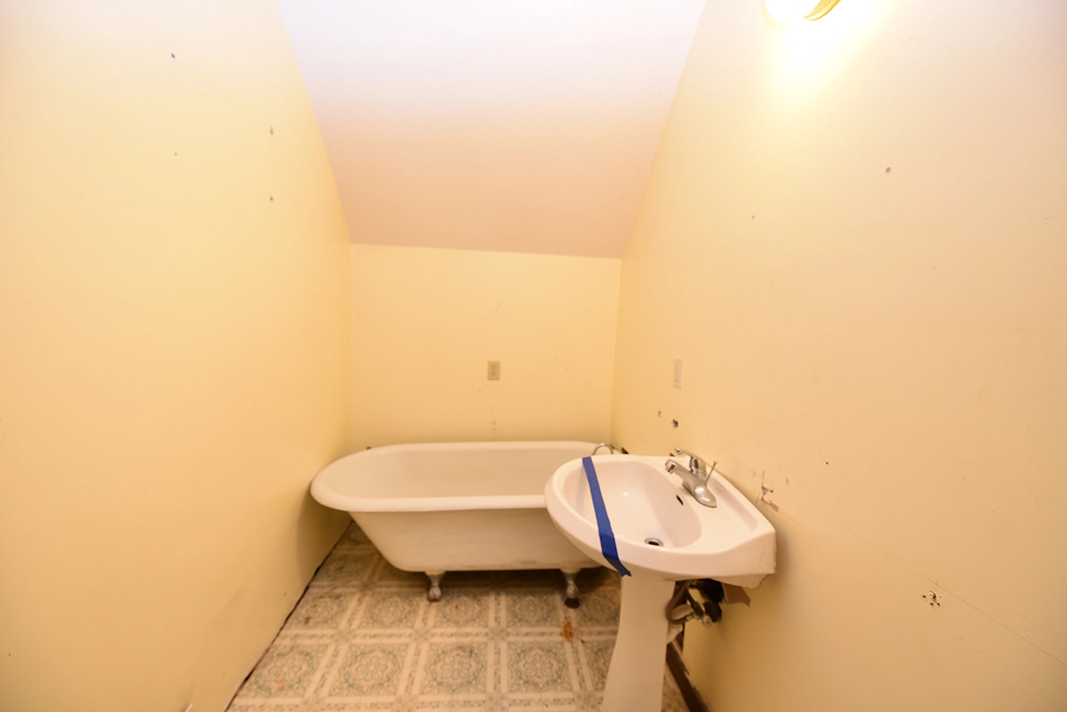 Small dated master bathroom before wall removal and expansion in Maple Grove MN